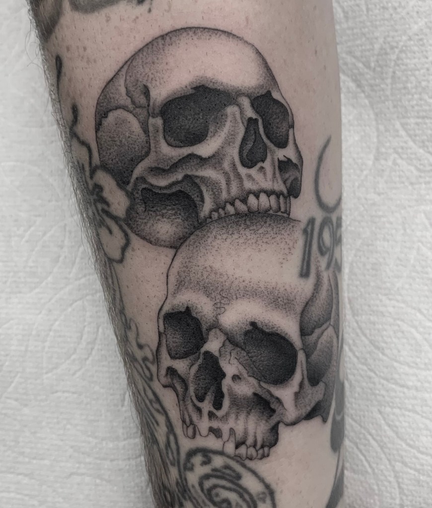 realistic-fine-line-skull-tattoo