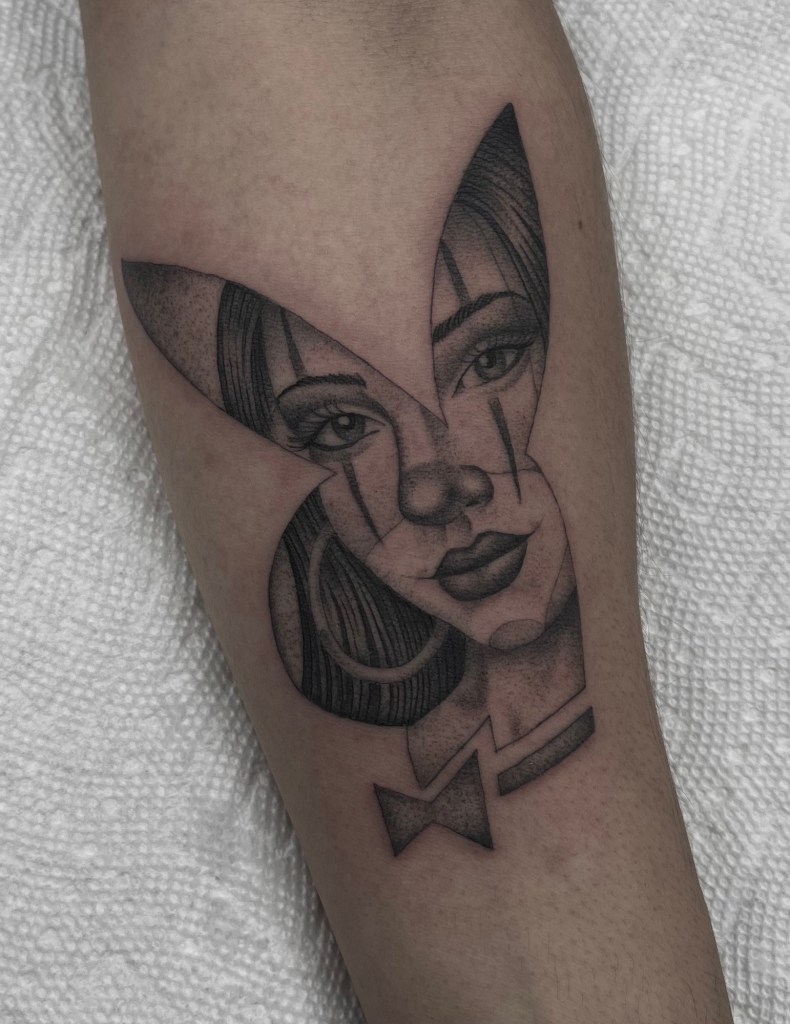 single-needle-playboy-girl-tattoo