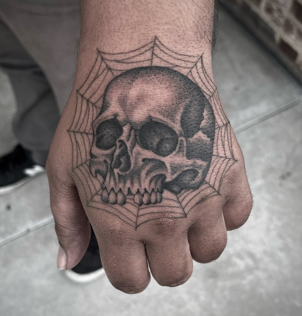 skull-spider-web-hand-tattoo