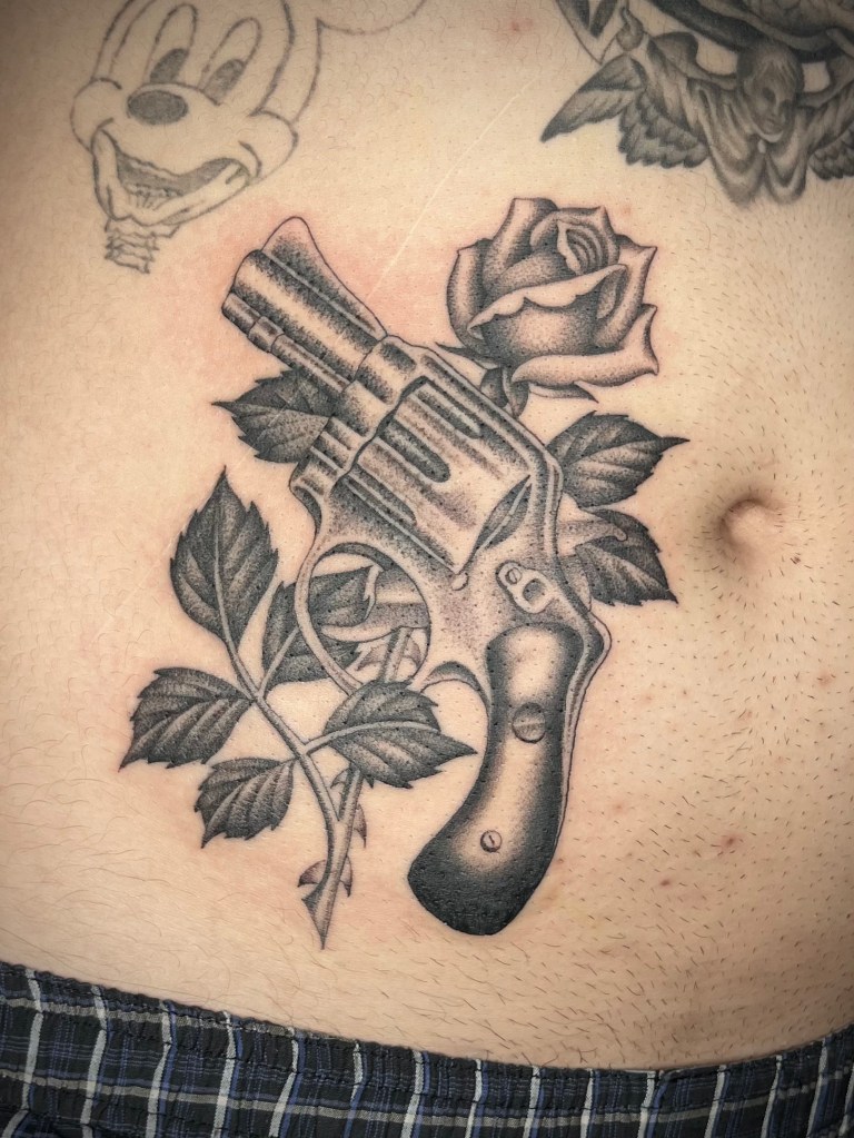 revolver gun and rose tattoo